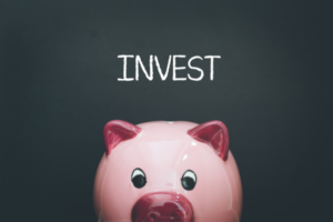 Health Savings Account. Piggy bank with word Invest