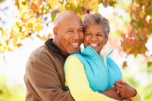 Health Savings Account African American couple hugging Over 65